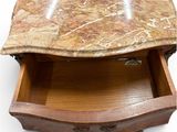 a marble top drawer with a wooden drawer underneath it