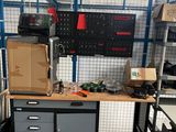 an image of a workbench in a warehouse with a lot of tools