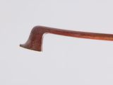 someone is holding a wooden stick in their hand with a white background