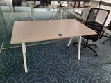 tables and chairs in an office with glass walls and blue carpet