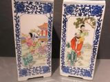 pair of blue and white porcelain vases with asian figures