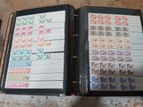 a black binder with stamps on it sitting on a table