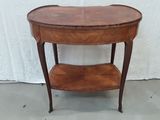 a small wooden table with a shelf on it