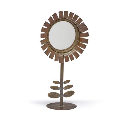 une image représentant un miroir posé sur un pied, avec une fleur au centre