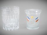 two shot glasses sitting next to each other on a table