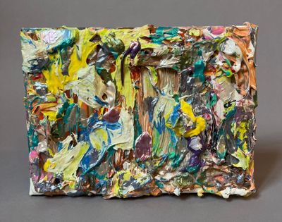 an image of a close up of a painting on a gray surface
