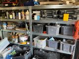 many bins and containers on the shelves in the garage
