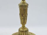 an image of a gold candle holder on a white background