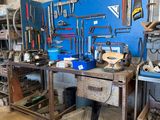 a picture of a workbench in a garage with tools on it
