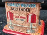 a wooden box with a sign on it that says charley weaver bartender
