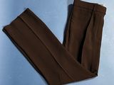 brown pants on a blue surface with a blue background