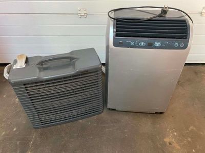 a small air conditioner next to a small air conditioner