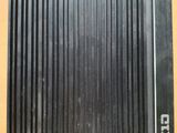 a close up of a piece of metal on a wooden table