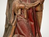 an image of a statue of a woman holding a book