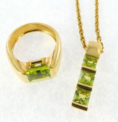yellow gold plated necklace and ring set with peridot stones