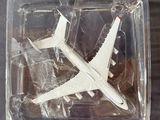 a plastic box with a model of a plane inside of it