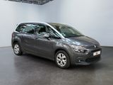 the grey citrole is parked in a large room