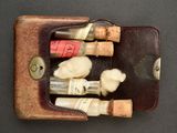 a leather case with several bottles of wine in it