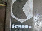 a sign that says schila on the side of a building
