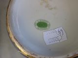 a close up of a plate with a sticker on it