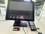 a television sitting on top of a desk with a remote control
