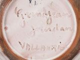 a close up of a plate with writing on it