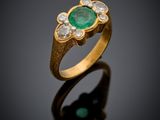 an emerald and diamond ring