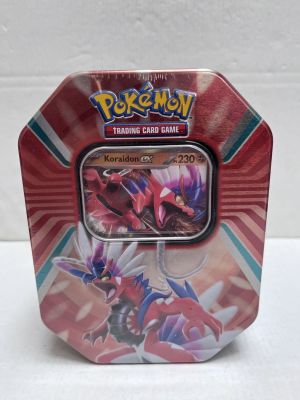 a close up of a pokemon trading card game in a tin