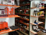 many shelves in the store that have various items on them