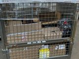 a metal cage with a bunch of boxes in it