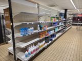 many shelves in the store with cleaning products on them