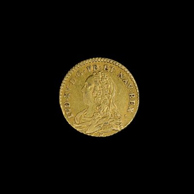 l'image d'une pièce d'or sur laquelle figure une femme