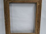 an old wooden picture frame with a white background