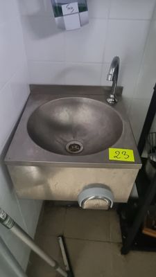 a bathroom with a sink and a mirror in it