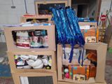 a pile of boxes and a pair of scissors on top of it