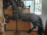a statue of a horse that is standing on its hind legs