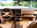 a view of the inside of a car from the driver ' s seat