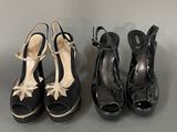 three pairs of women ' s shoes are lined up on a table