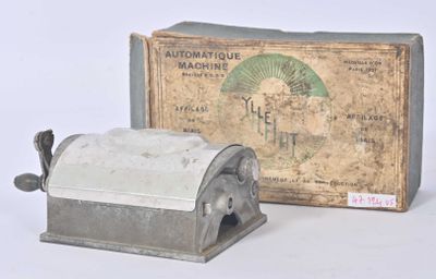 an old machine that is sitting next to a box