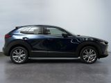 the mazda cx - hr is parked in the garage