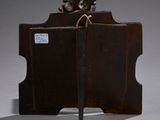 a wooden box with a knife in it on a table