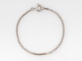 a silver bracelet with a chain on a white background