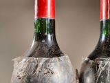 two bottles of wine that are sitting on a table