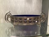 a glass display case with a blue bowl on it