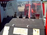 a close up of a red truck with a glass windshield
