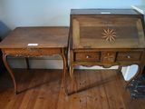 two wooden tables with drawers on them in a room