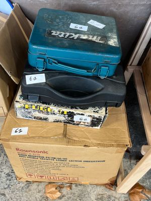 two boxes of tools sitting on top of each other