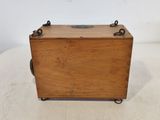 an old wooden box sitting on top of a table