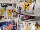 many bags of baby items that include giraffes and zebras