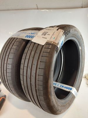two tires are stacked on top of each other on a table